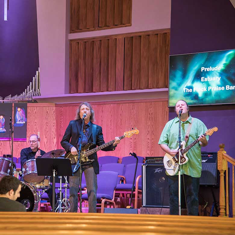 Church band play guitars and drums